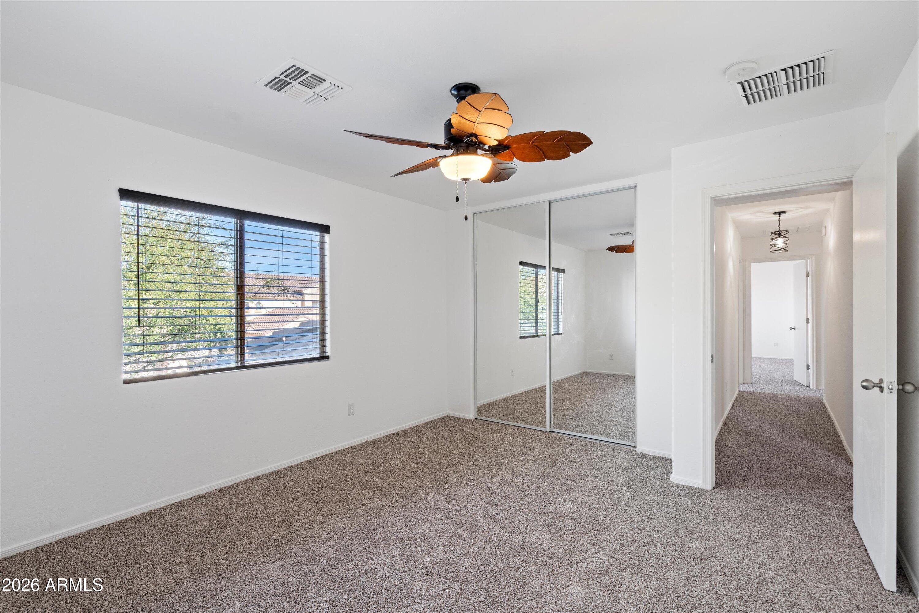 1231 West Ocotillo Street Coolidge, AZ 85128 - Photo 39 of 57 a view of an empty room with a ceiling fan