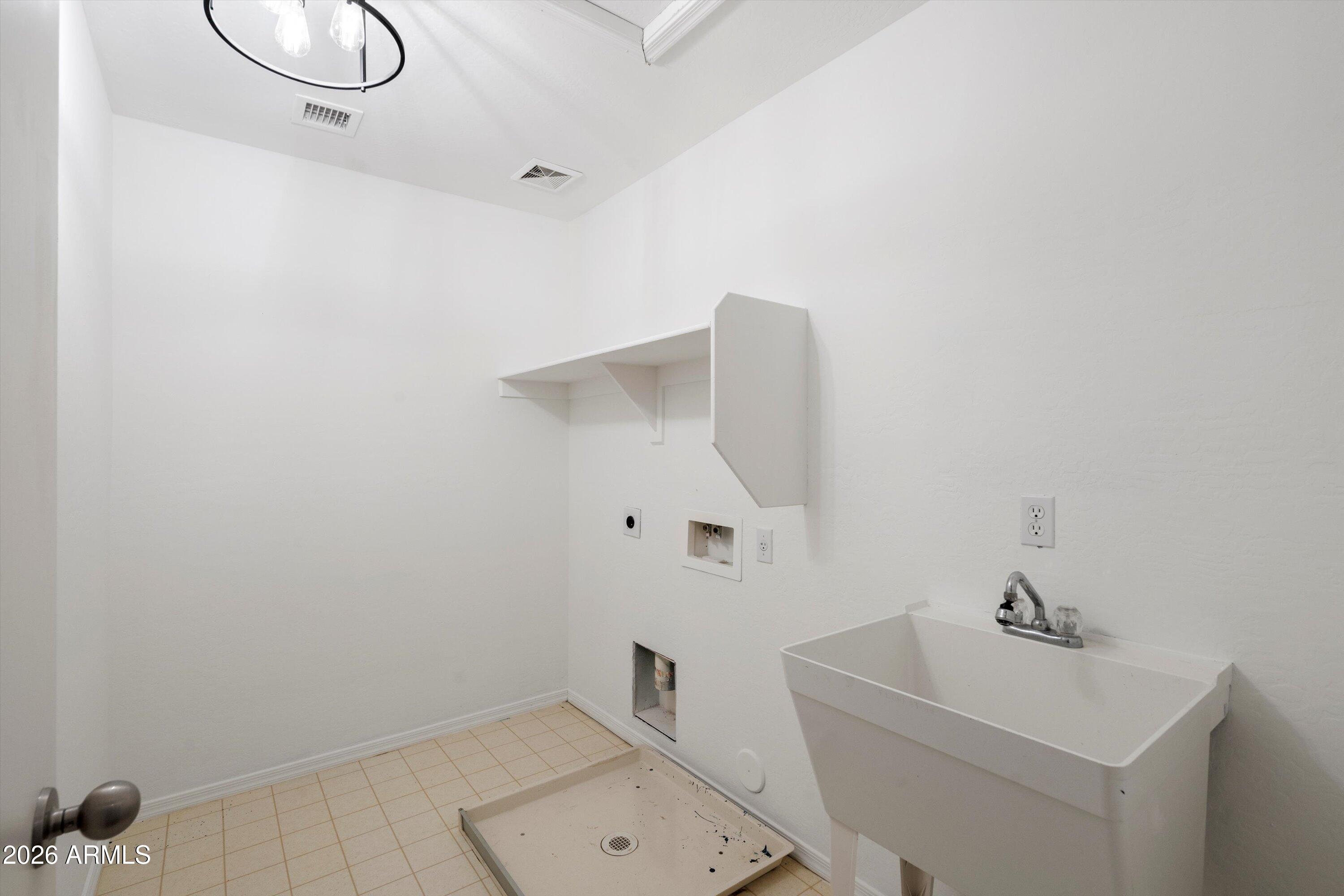 1231 West Ocotillo Street Coolidge, AZ 85128 - Photo 40 of 57 a bathroom with a sink and mirror
