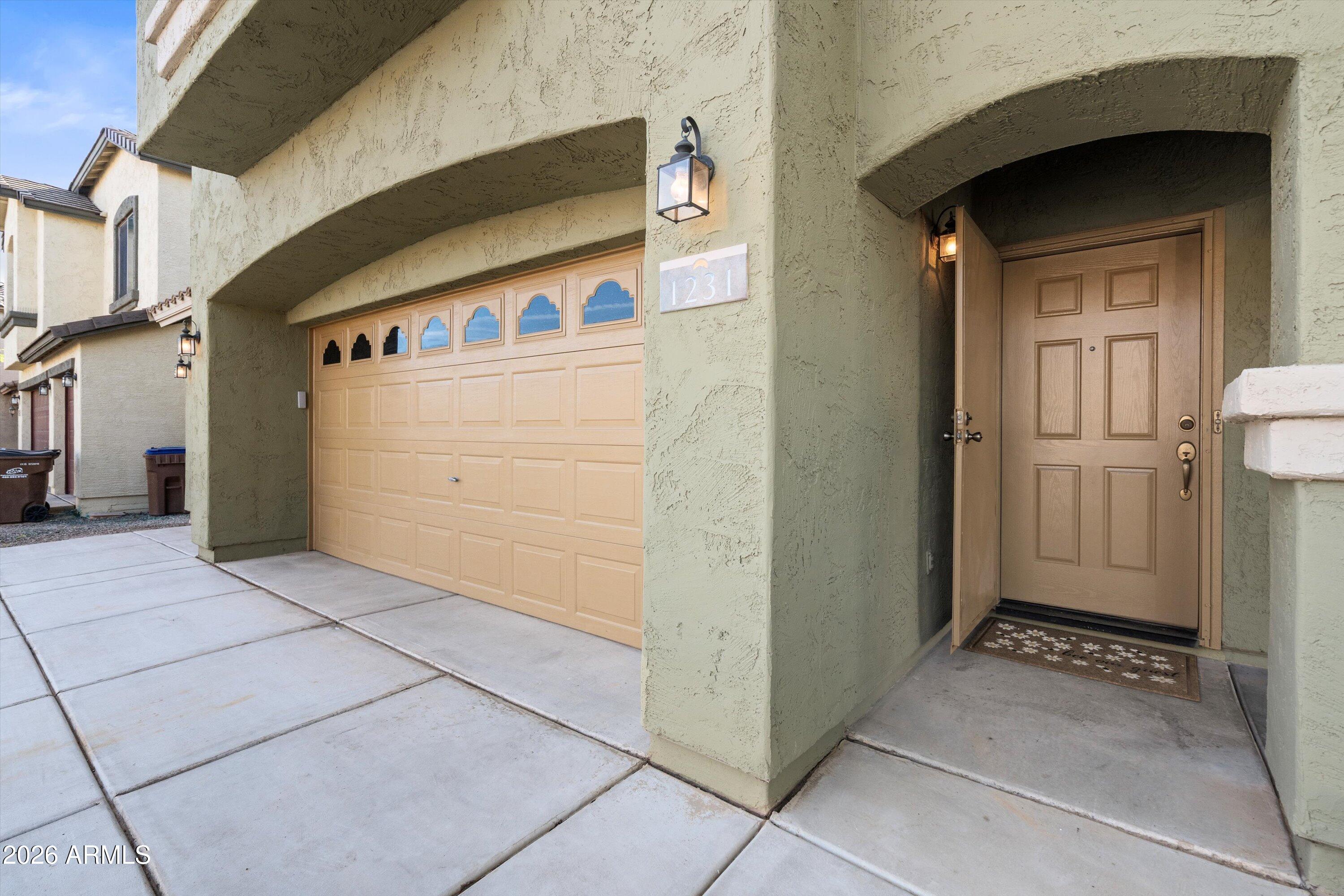 1231 West Ocotillo Street Coolidge, AZ 85128 - Photo 4 of 57 a view of a car garage door