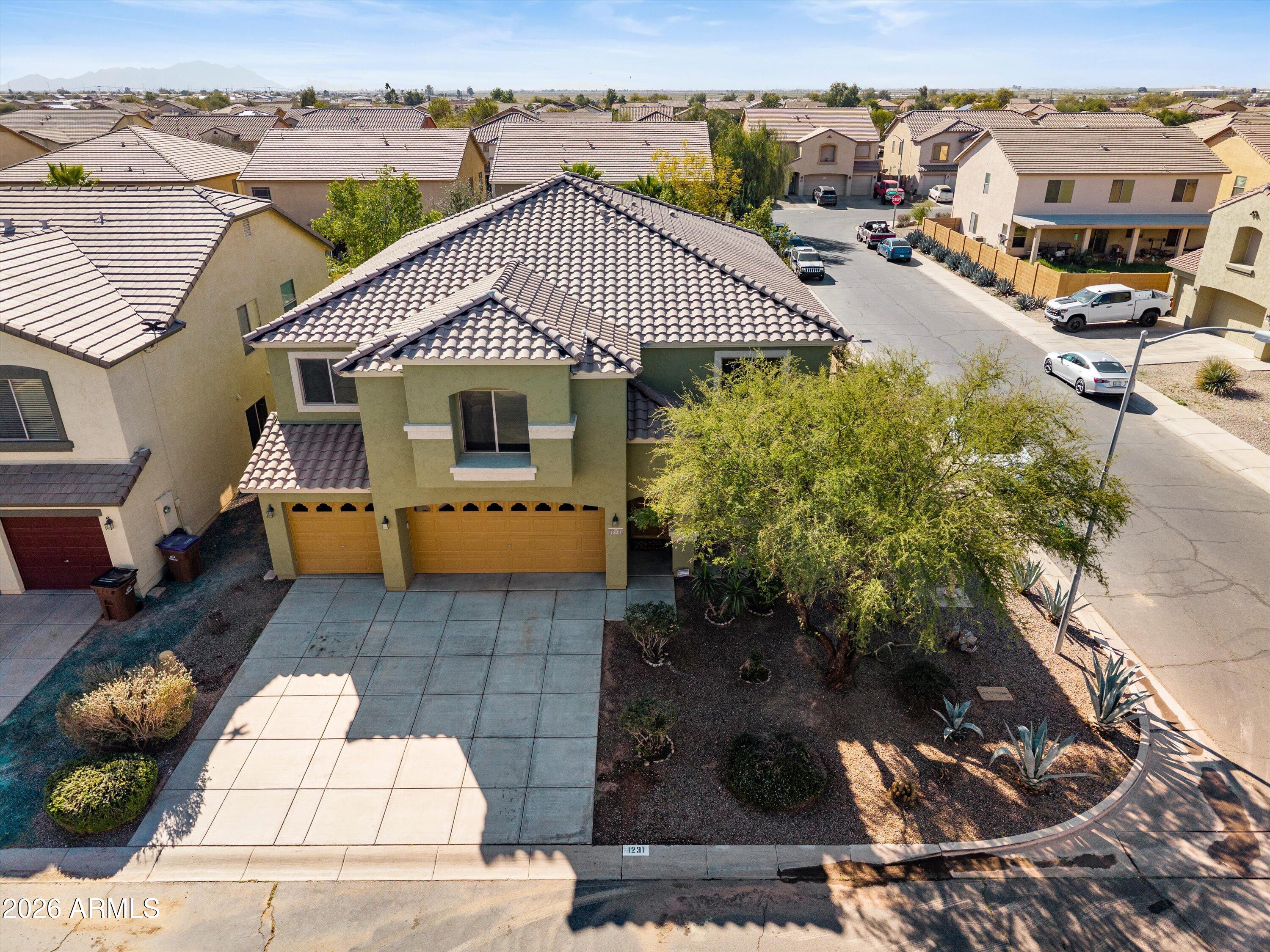 1231 West Ocotillo Street Coolidge, AZ 85128 - Photo 44 of 57 an aerial view of a house with a yard