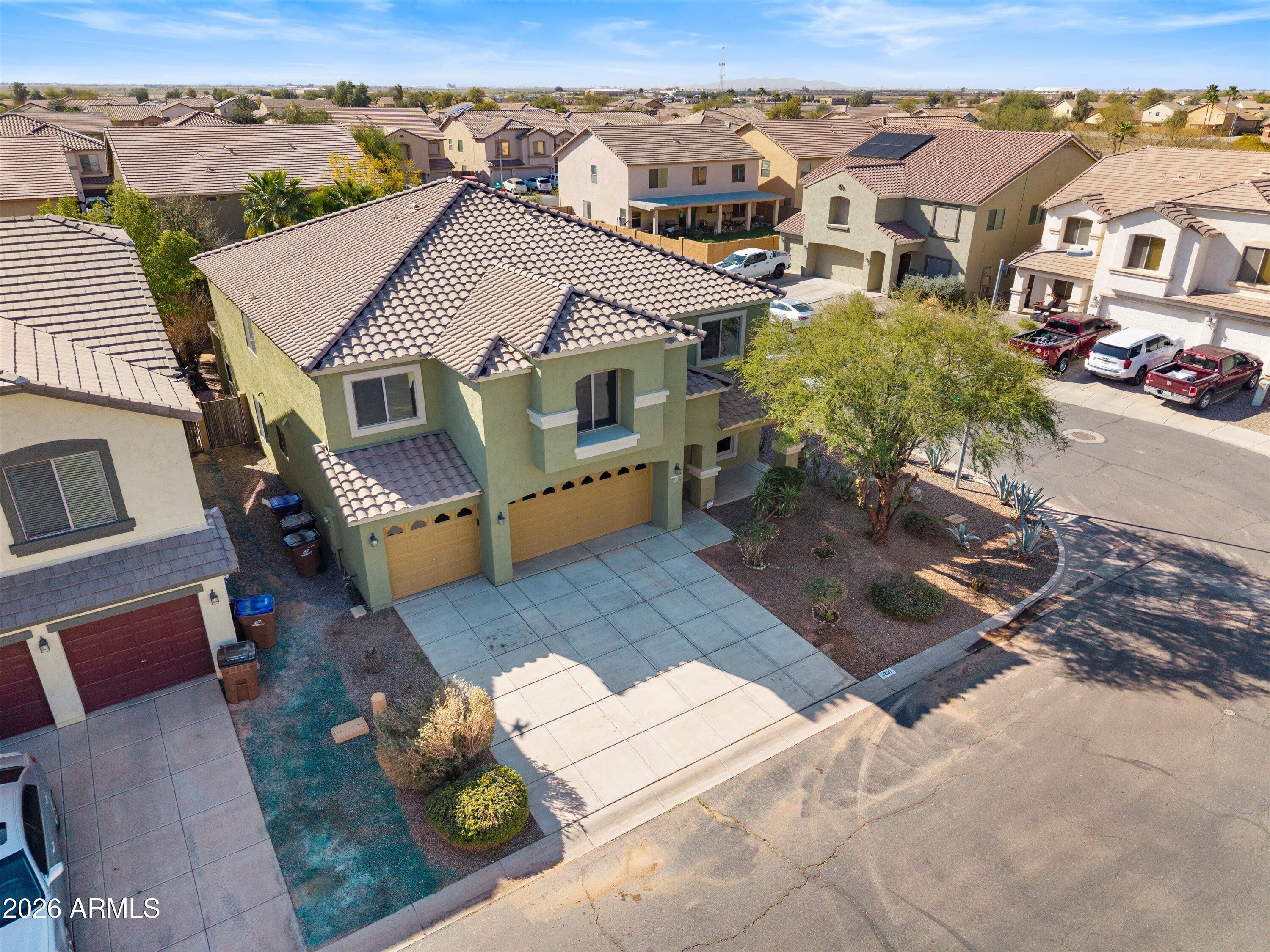 1231 West Ocotillo Street Coolidge, AZ 85128 - Photo 45 of 57 an aerial view of a house with a yard