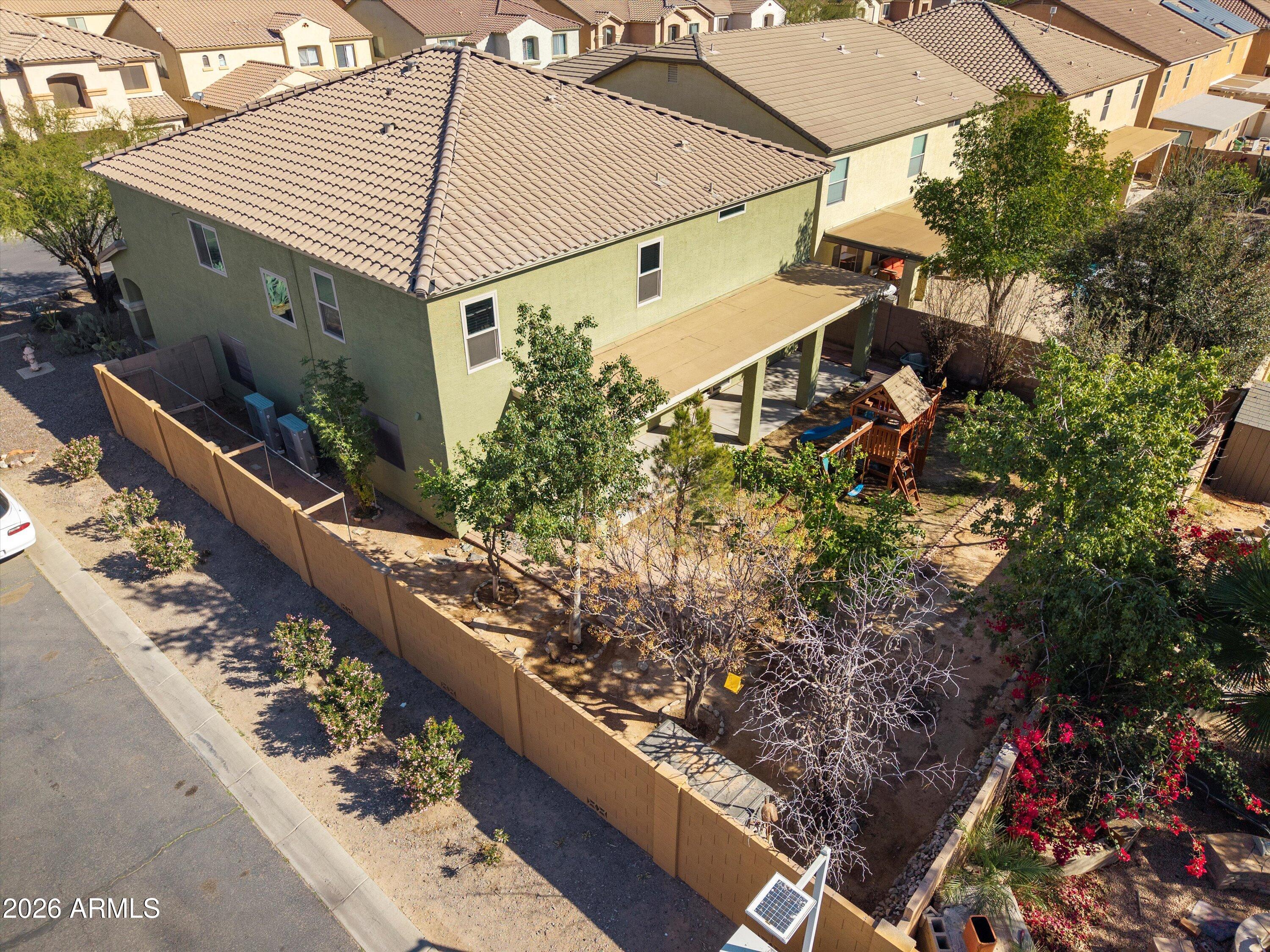 1231 West Ocotillo Street Coolidge, AZ 85128 - Photo 51 of 57 front view of a house with a yard and potted plants
