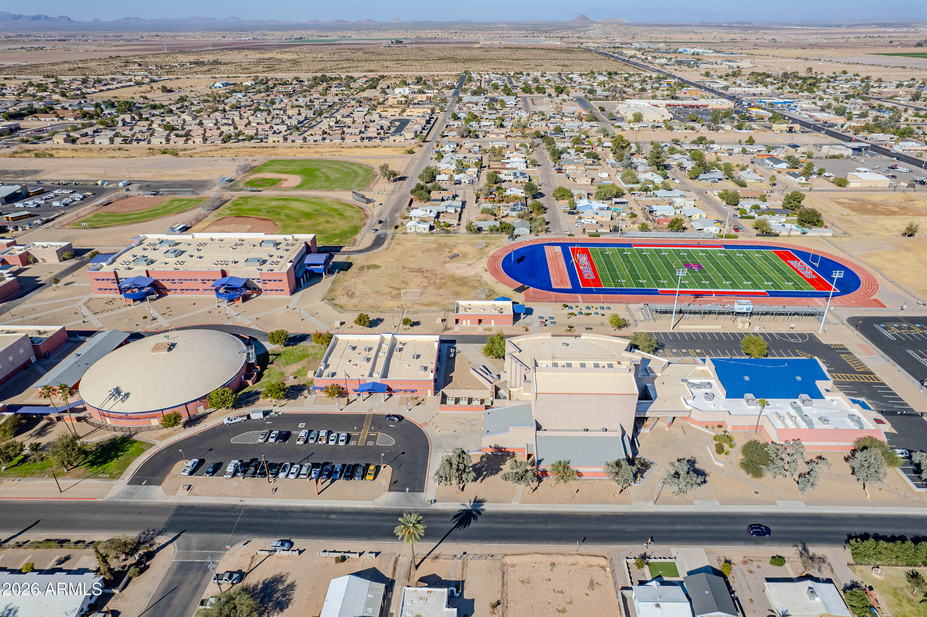 1231 West Ocotillo Street Coolidge, AZ 85128 - Photo 56 of 57 an aerial view of residential houses with outdoor space