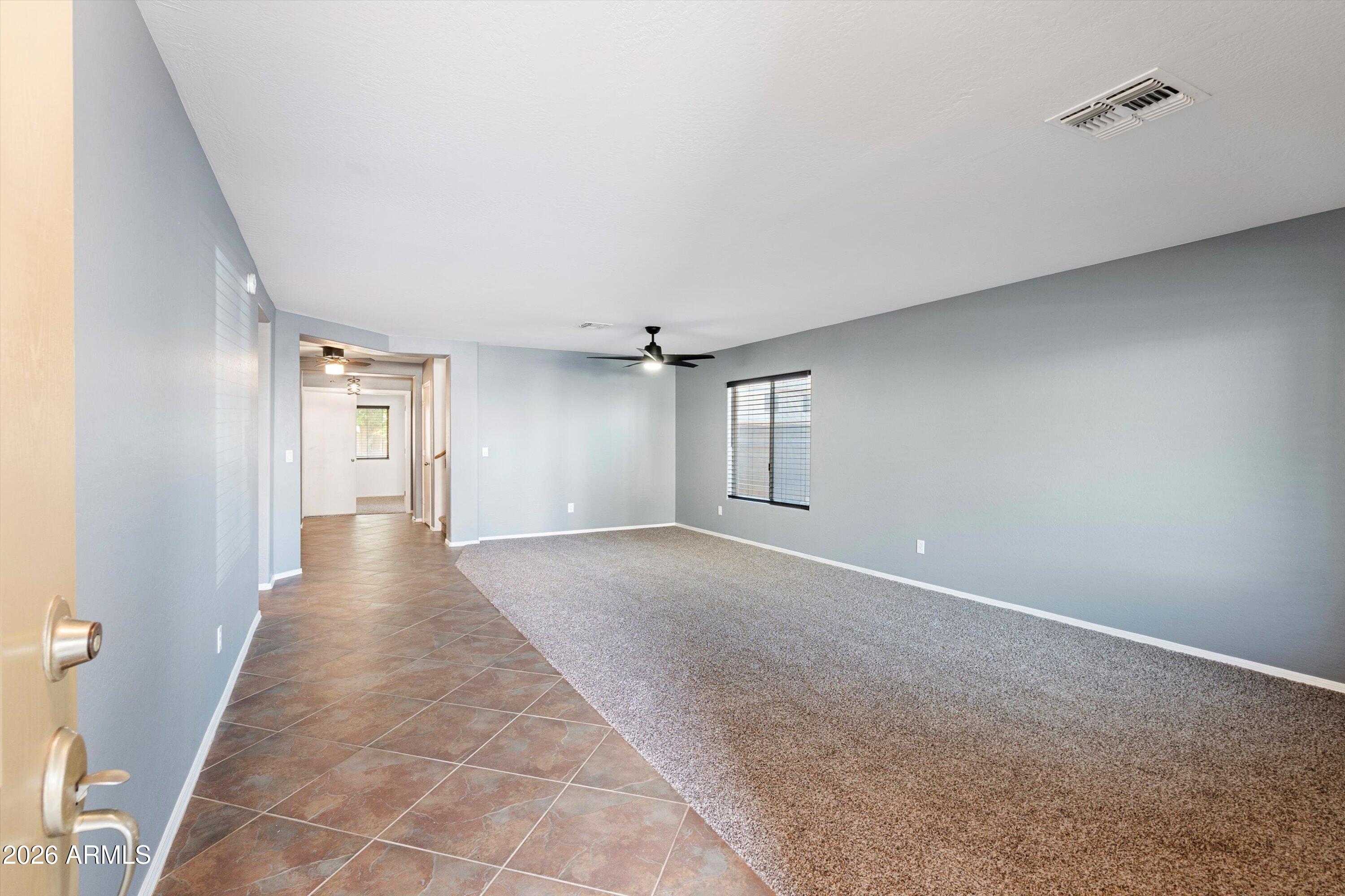 1231 West Ocotillo Street Coolidge, AZ 85128 - Photo 6 of 57 a view of a hallway with wooden floor and staircase