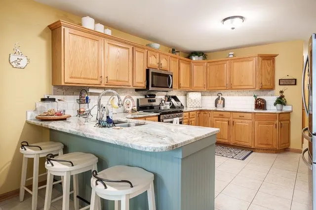 a kitchen with a sink cabinets and window