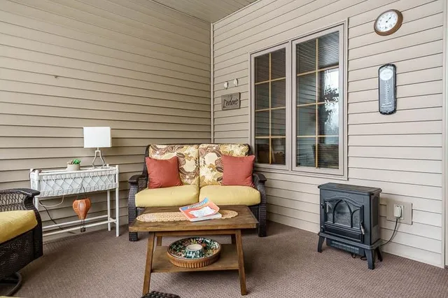 a outdoor space with patio furniture and a fireplace