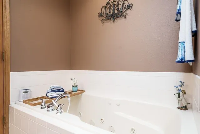 a bathroom with a bathtub and a sink