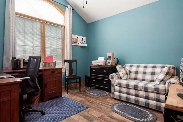 a bedroom with a workspace