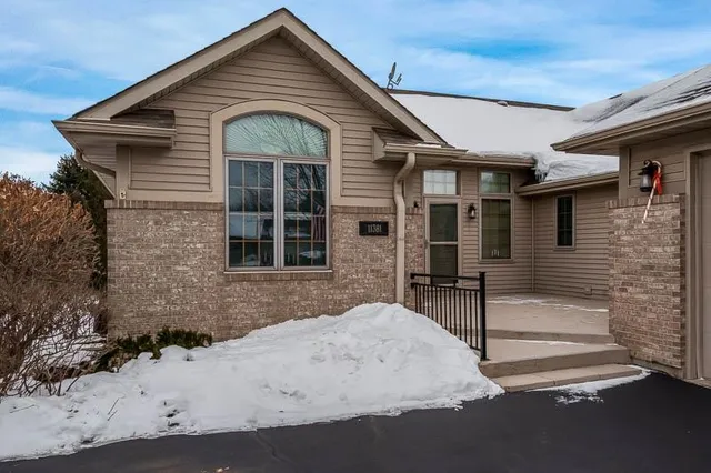 a front view of a house with glass windows