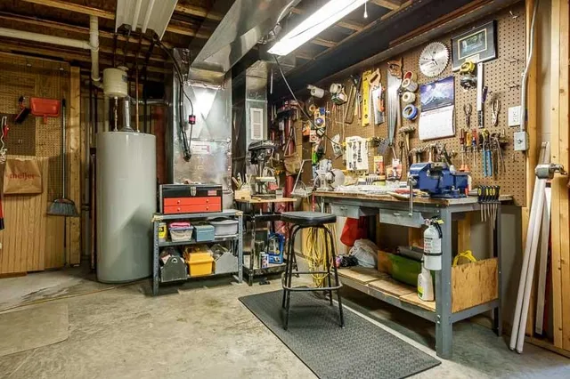 a view of a house with a snow in the road