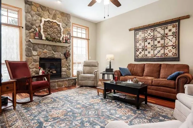 a living room with furniture and a fireplace