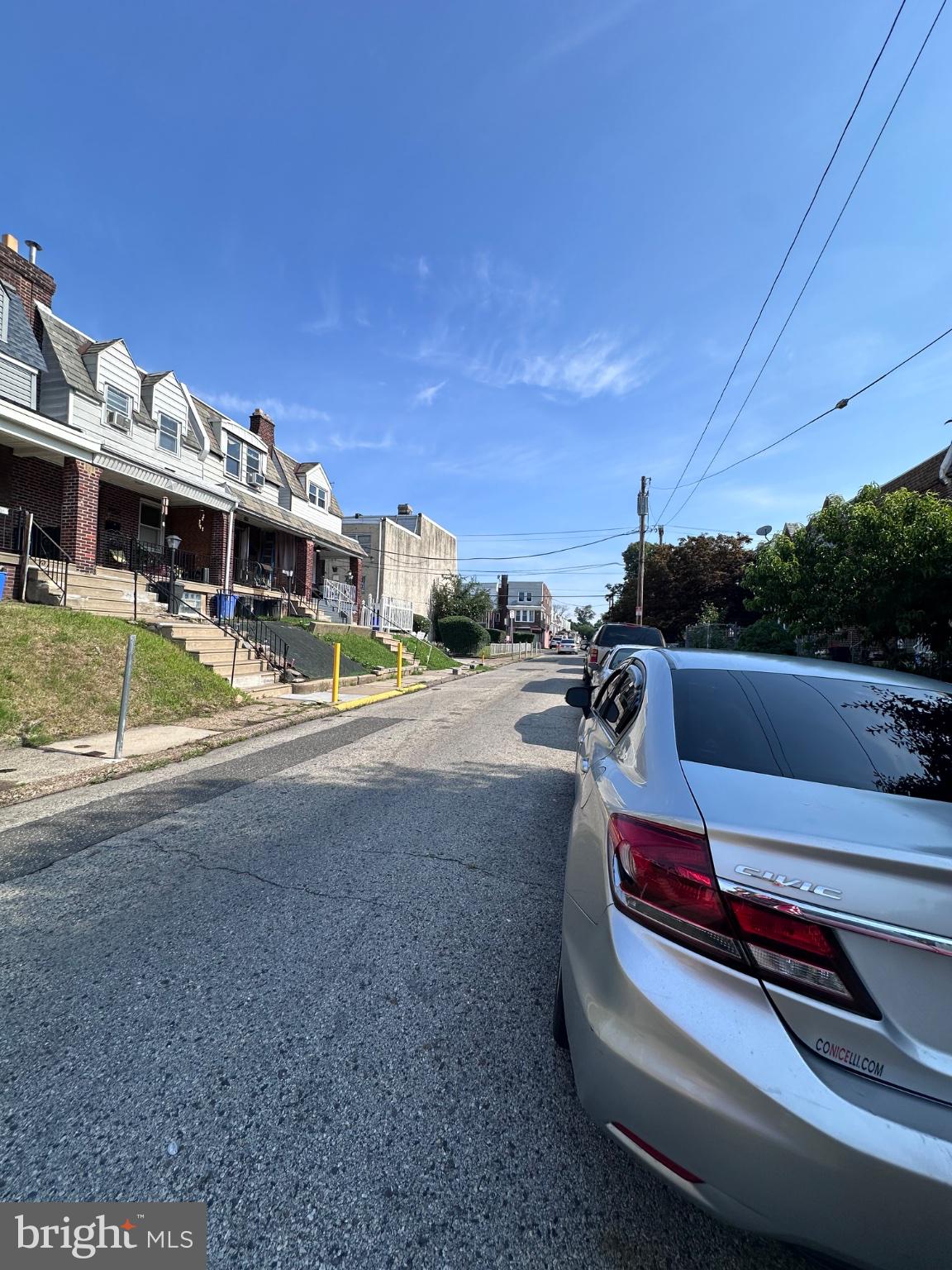 3948 Howland Street Philadelphia, PA 19124 - Photo 20 of 21 Charming street under a clear sky.