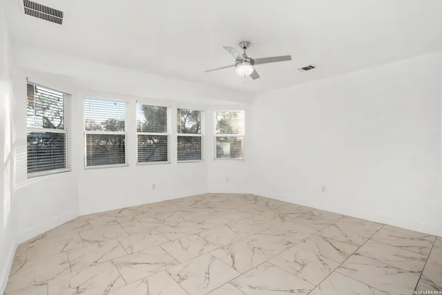 a view of an empty room with a window