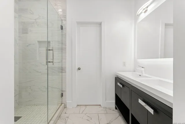 a bathroom with a sink and a mirror
