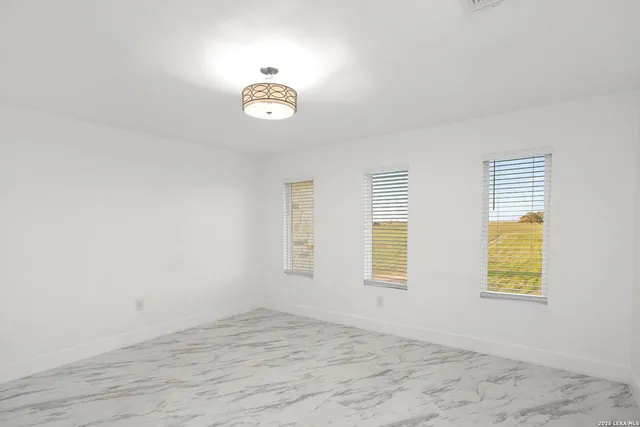 an empty room with windows