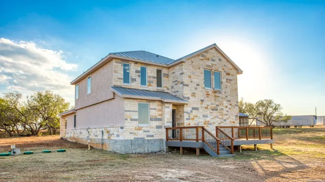 a front view of a house with patio
