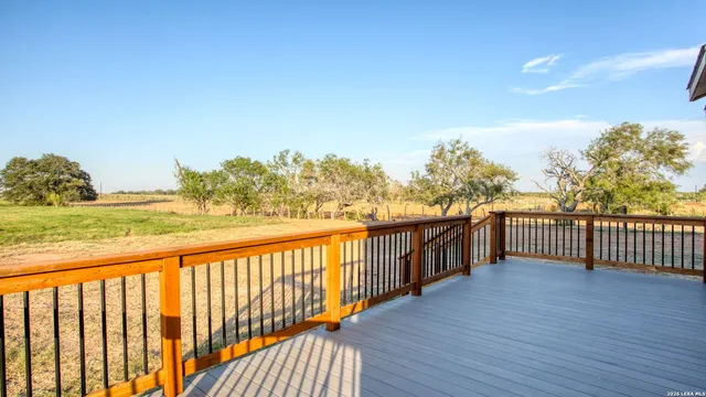 a view of a balcony with wooden floor