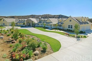 30210 Romero Canyon Road Castaic, CA 91384 - Photo 1 of 1 a front view of a house with a yard and large trees