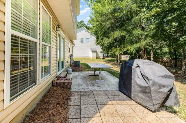 a view of a patio with a table and chairs and wooden floor
