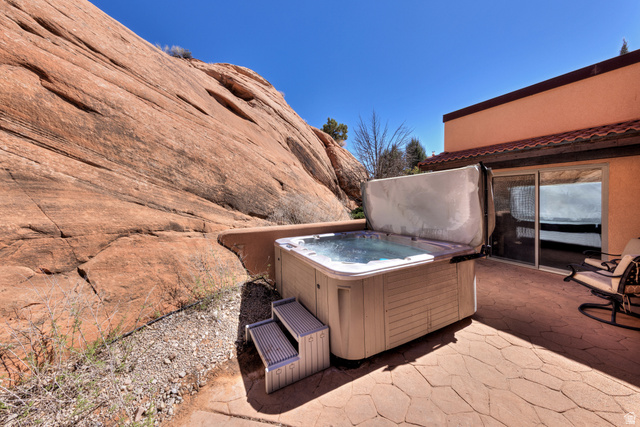 3461 Westwater Road, Unit 6 Moab, UT 84532 - Photo 29 of 33 View of patio / terrace featuring a hot tub