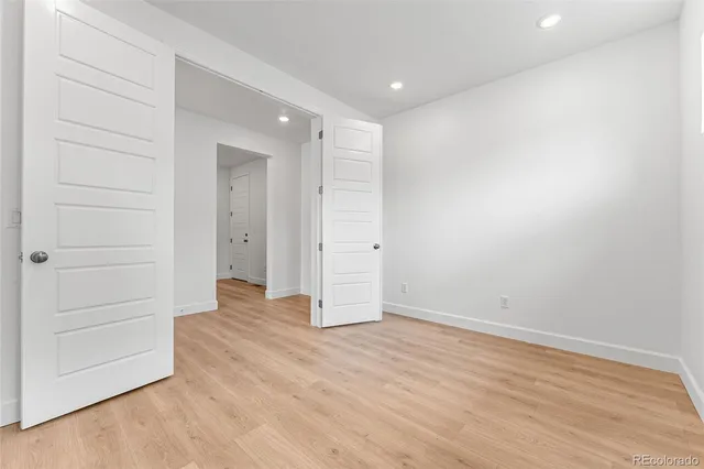 a bathroom with a toilet a sink a mirror a bathtub and shower