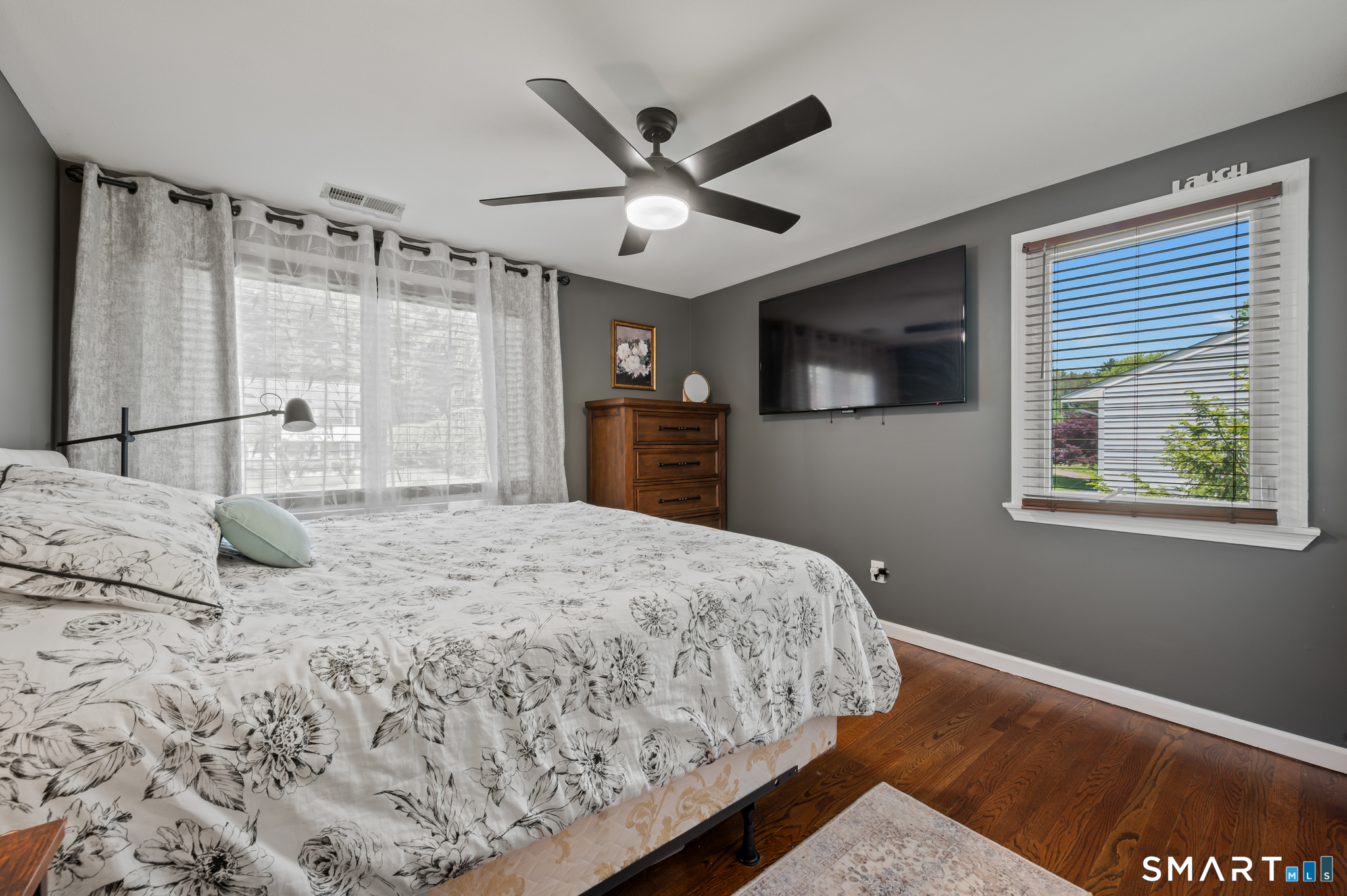 201 Ridge Crest Circle Wethersfield, CT 06109 - Photo 16 of 35 a bedroom with a large bed chandelier and a window