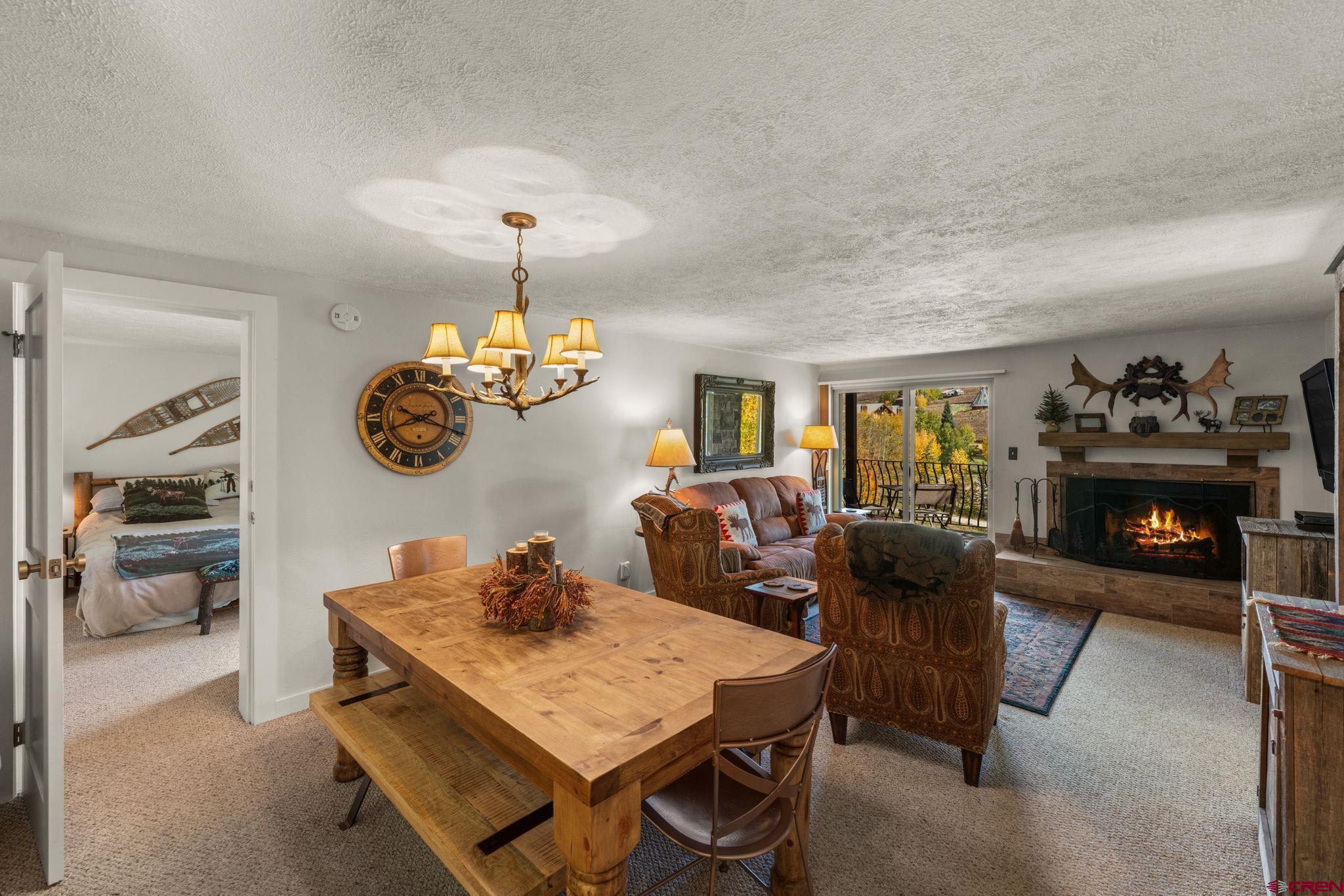 651 Gothic Road, Unit 502 Crested Butte, CO 81225 - Photo 11 of 44 a living room with furniture and a fireplace
