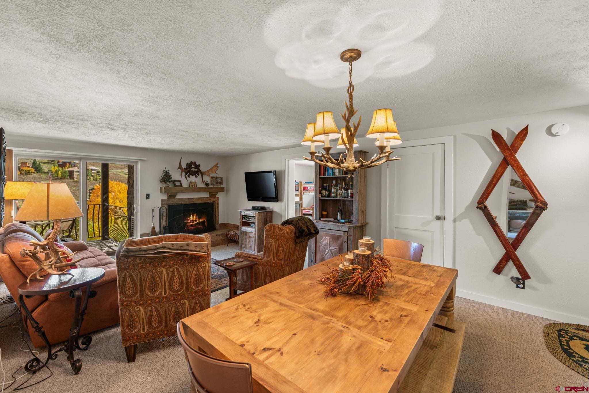 651 Gothic Road, Unit 502 Crested Butte, CO 81225 - Photo 13 of 44 a view of a dining room with furniture