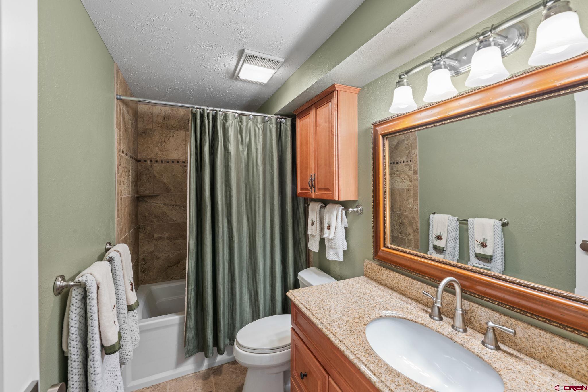 651 Gothic Road, Unit 502 Crested Butte, CO 81225 - Photo 26 of 44 a bathroom with a sink toilet and shower
