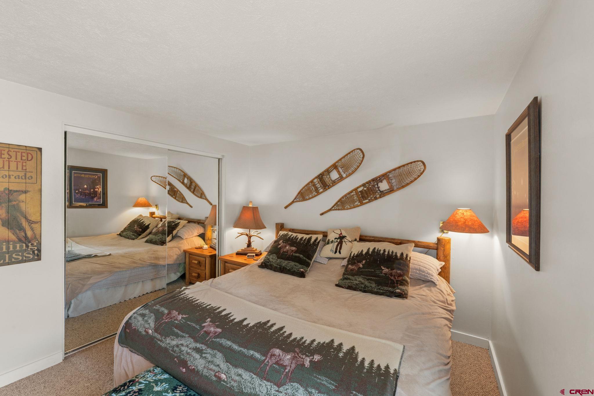 651 Gothic Road, Unit 502 Crested Butte, CO 81225 - Photo 28 of 44 a bedroom with a bed and window