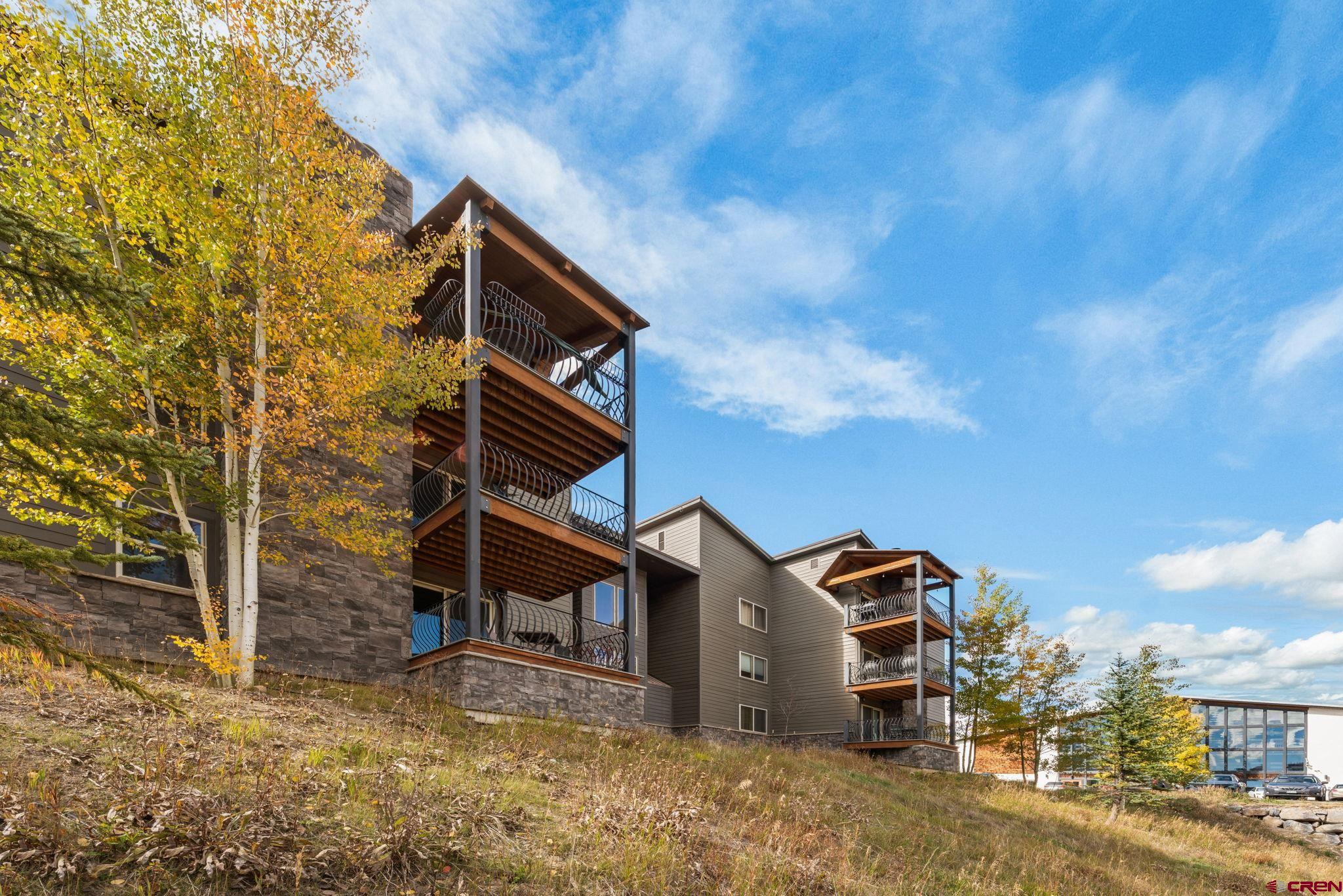 651 Gothic Road, Unit 502 Crested Butte, CO 81225 - Photo 35 of 44 a front view of a house with a yard