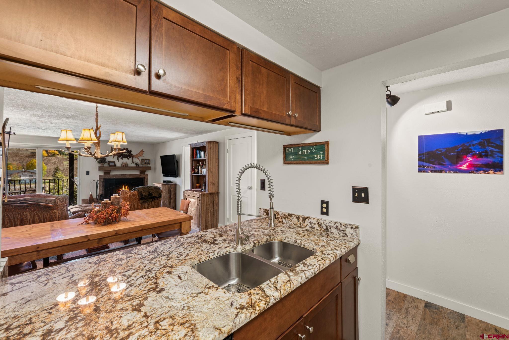 651 Gothic Road, Unit 502 Crested Butte, CO 81225 - Photo 5 of 44 a kitchen with a sink and cabinets