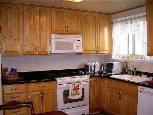 648 Parkview Circle Pacifica, CA 94044 - Photo 2 of 4 a kitchen with stainless steel appliances granite countertop white cabinets sink and dishwasher