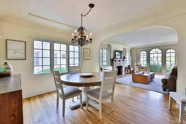 a kitchen with a stove and white cabinets