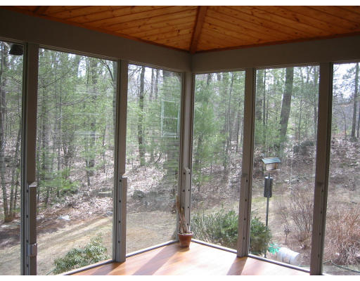 12 Cooper Pond Road Rowley, MA 01969 - Photo 6 of 9 a view of a glass room that has a big window