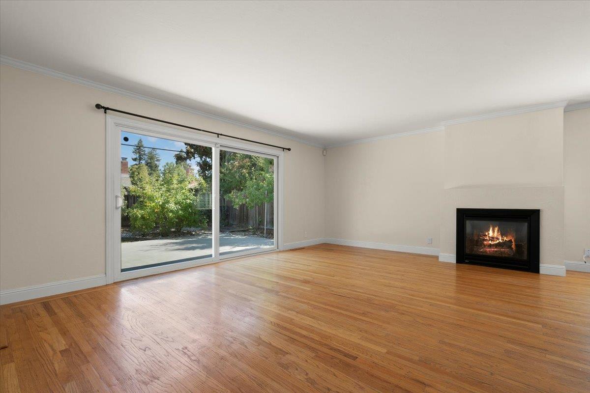 495 Giannini Drive Santa Clara, CA 95051 - Photo 4 of 21 a view of an empty room with a window and wooden floor