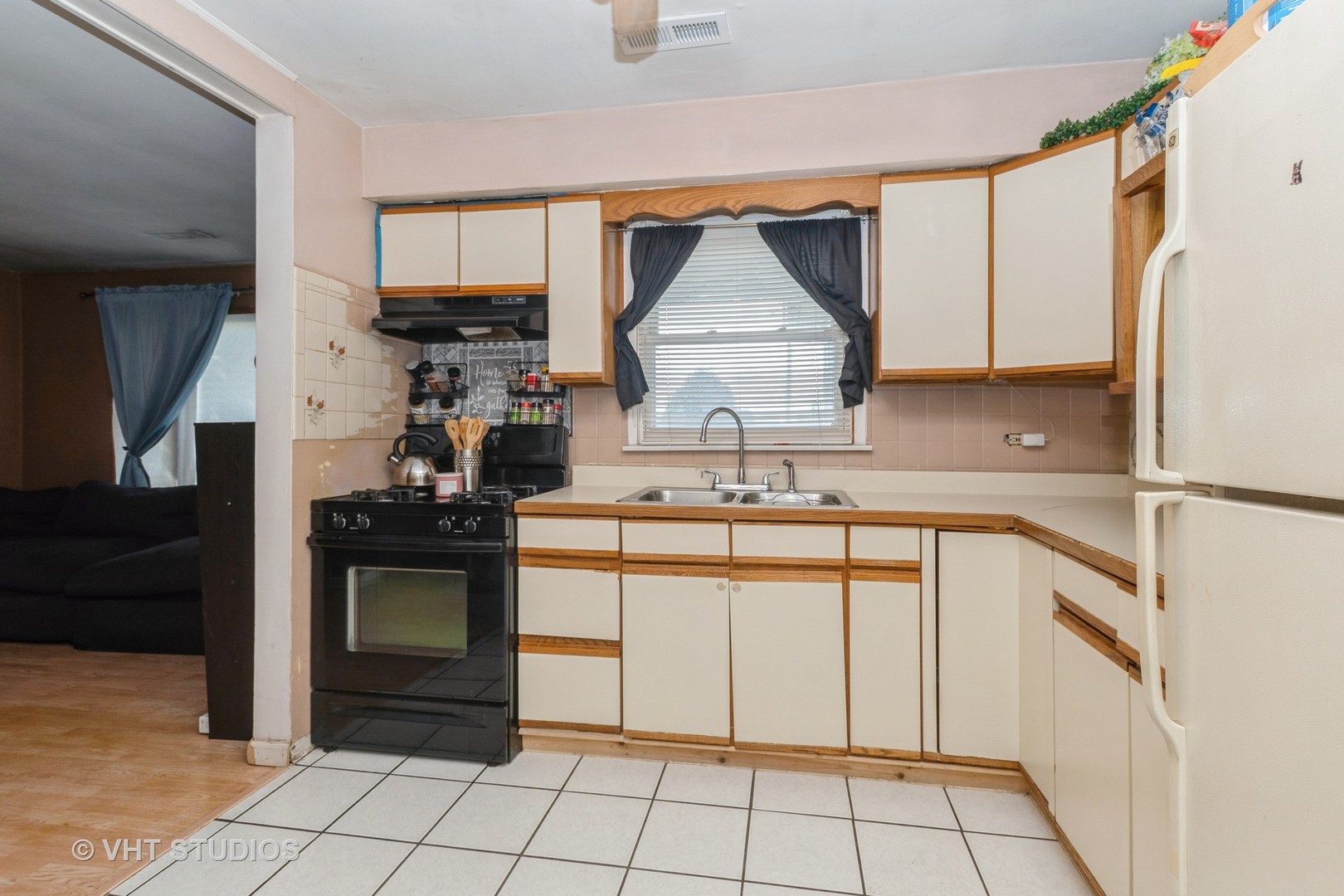5101 State Road Burbank, IL 60459 - Photo 13 of 16 a kitchen with a sink cabinets and appliances
