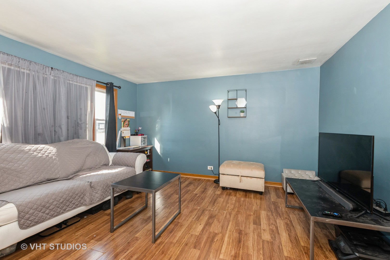 5101 State Road Burbank, IL 60459 - Photo 6 of 16 a bedroom with a bed and a flat screen tv