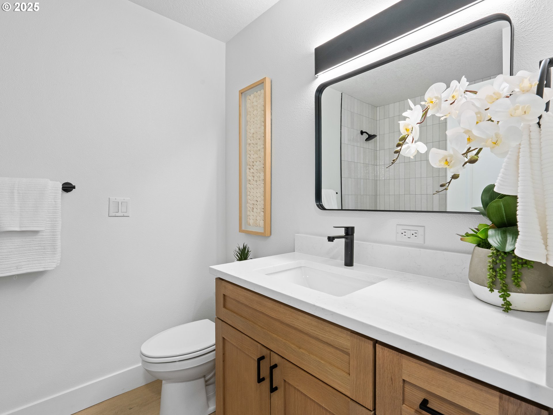 10701 Northeast 59th Street Vancouver, WA 98662 - Photo 13 of 16 a bathroom with a sink a toilet and mirror