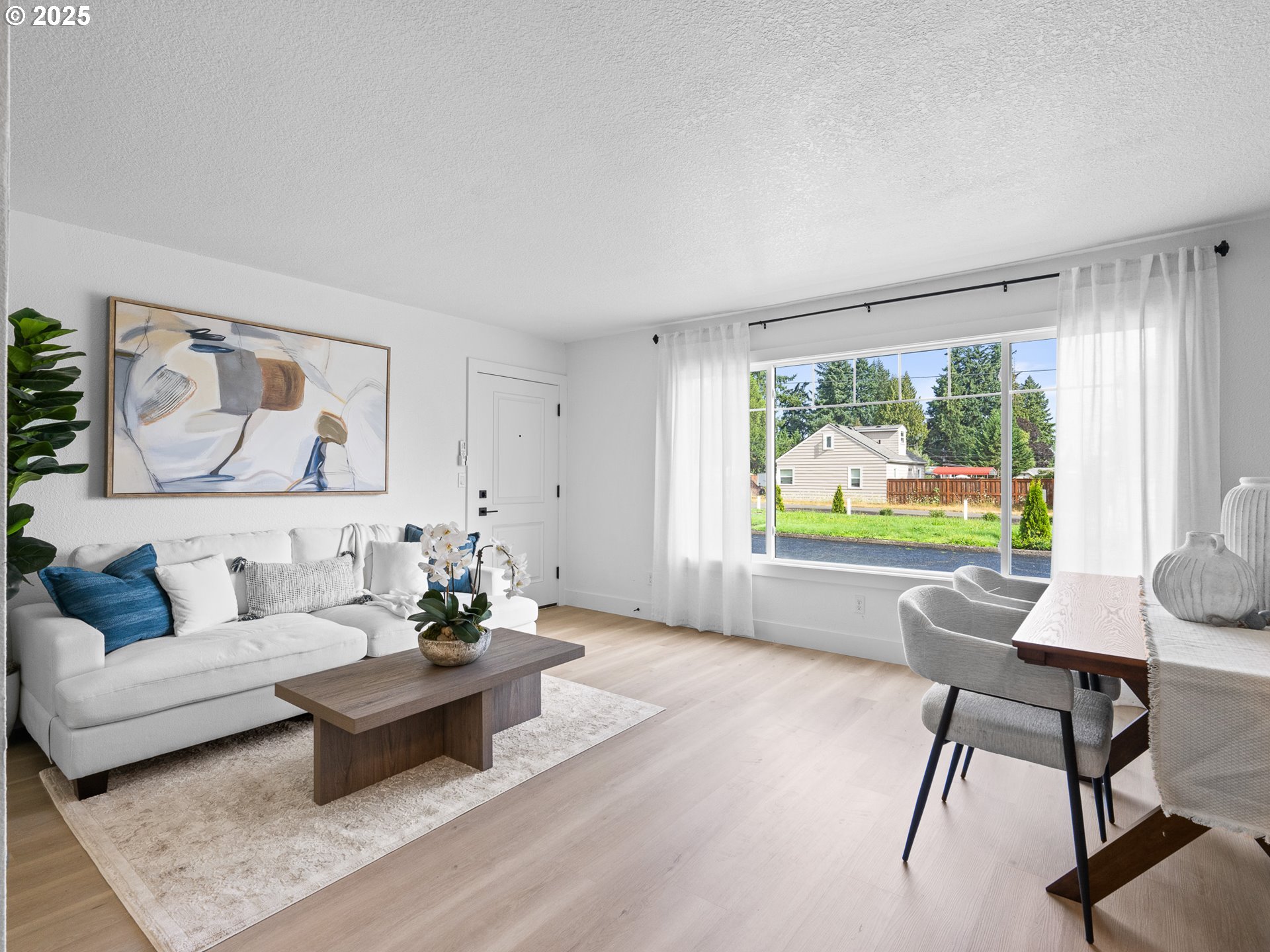 10701 Northeast 59th Street Vancouver, WA 98662 - Photo 5 of 16 a living room with furniture and a large window