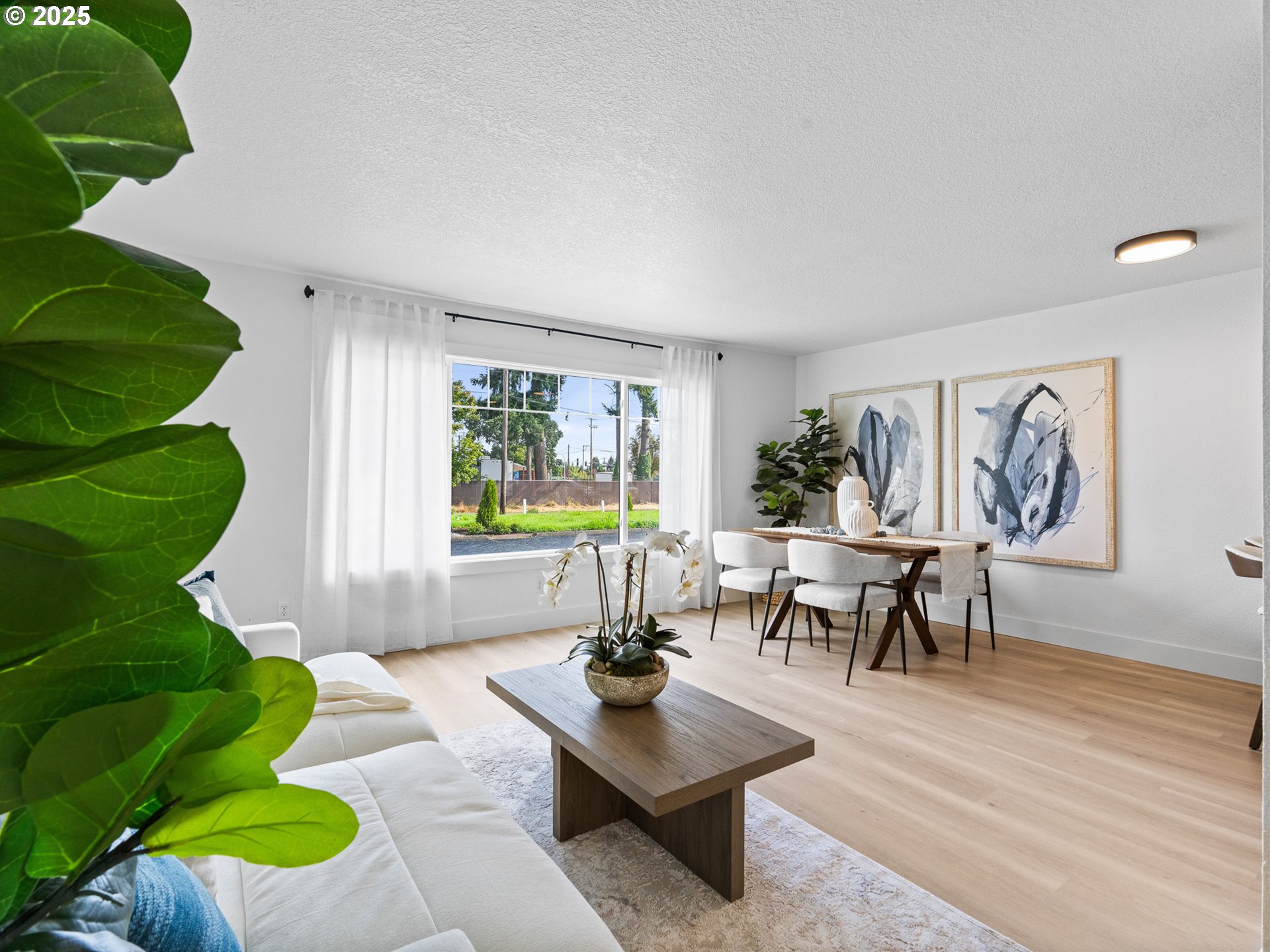 10701 Northeast 59th Street Vancouver, WA 98662 - Photo 6 of 16 a living room with furniture and a large window