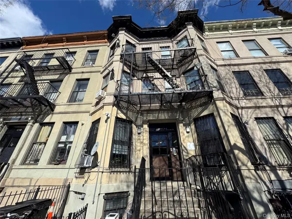 a front view of a building with a lot of windows
