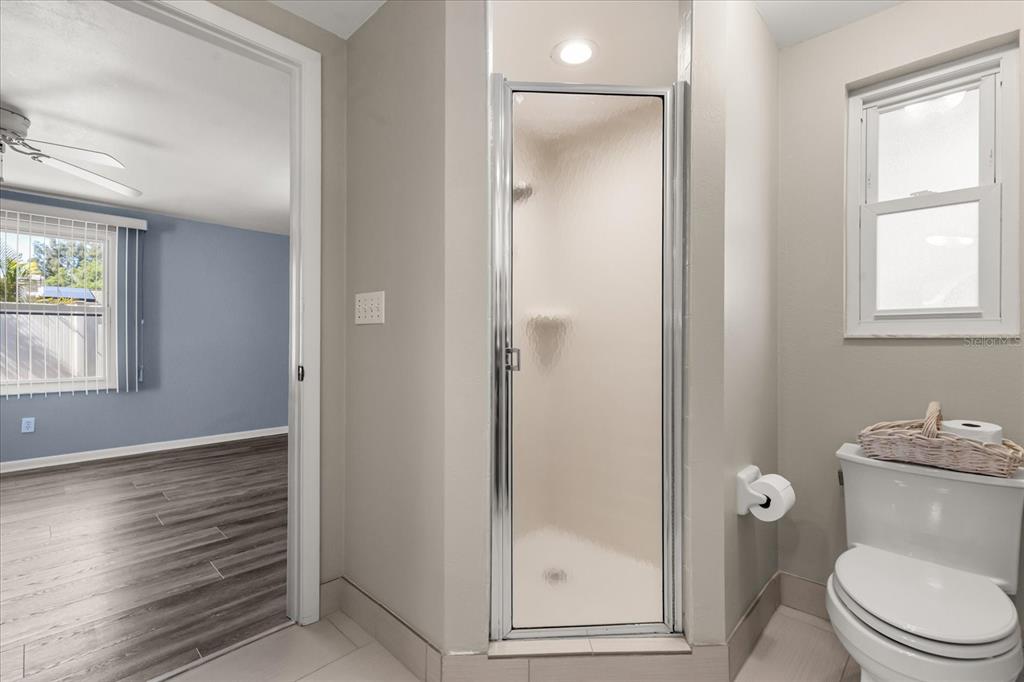 620 Jacaranda Street Dunedin, FL 34698 - Photo 14 of 30 a bathroom with a toilet and a shower