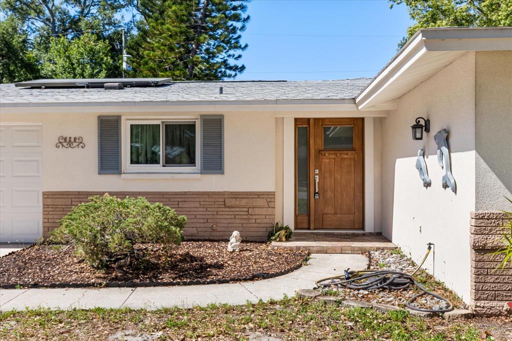 620 Jacaranda Street Dunedin, FL 34698 - Photo 2 of 30 a front view of a house