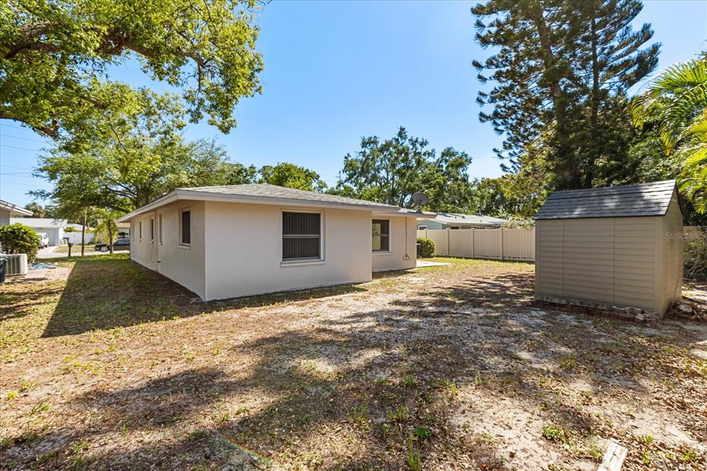 620 Jacaranda Street Dunedin, FL 34698 - Photo 21 of 30 a view of a house with a yard