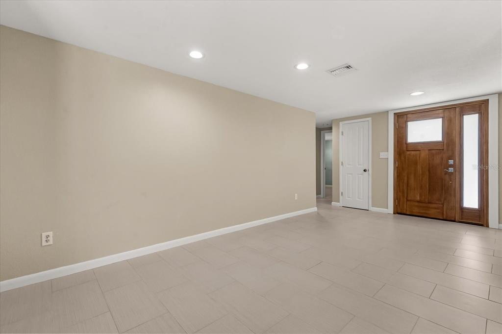 620 Jacaranda Street Dunedin, FL 34698 - Photo 4 of 30 a view of an empty room with window and closet area