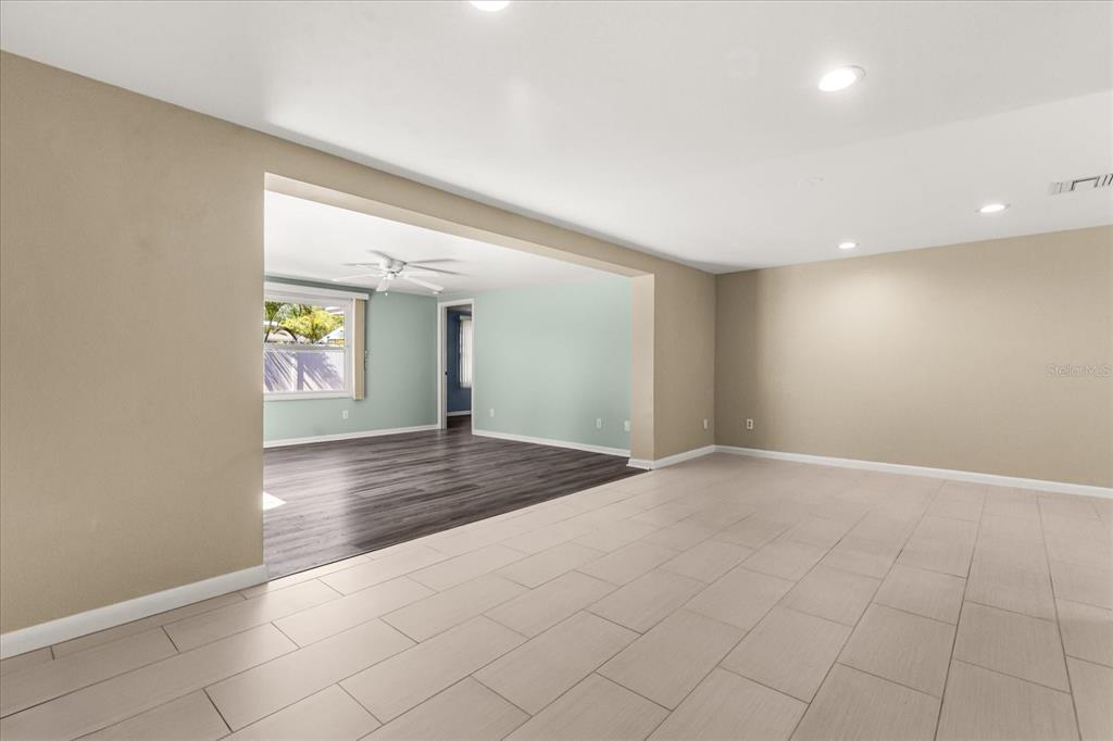620 Jacaranda Street Dunedin, FL 34698 - Photo 5 of 30 an empty room with windows and entrance