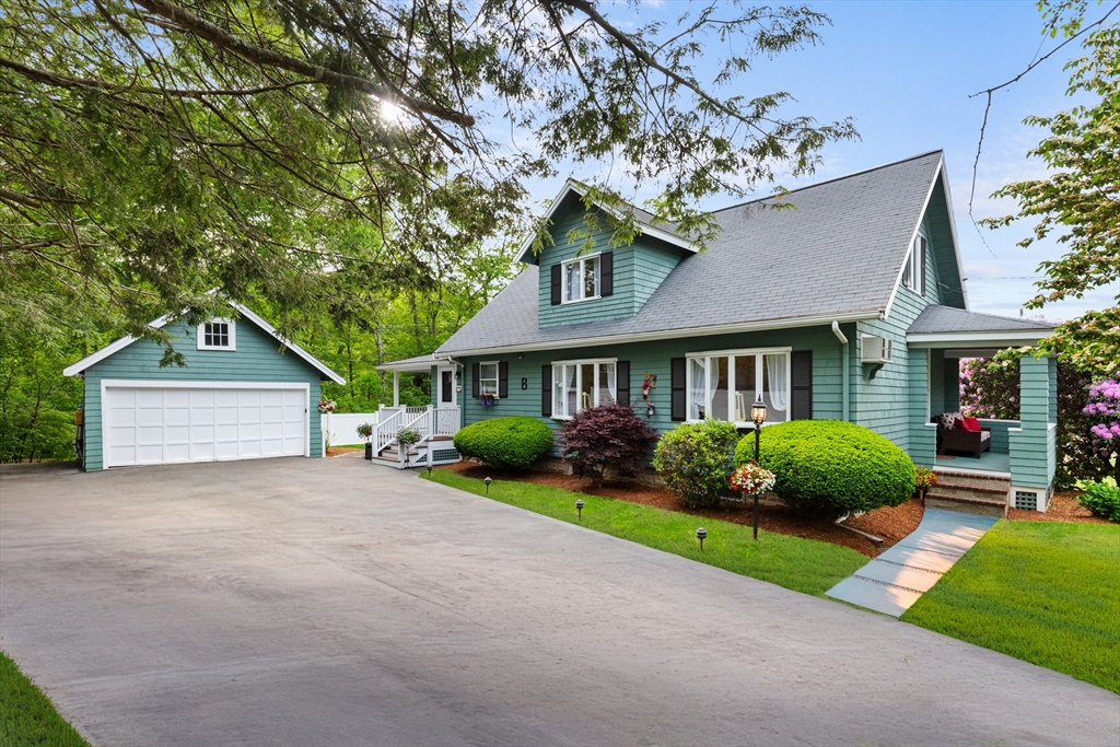 500 Lowell Street Lexington, MA 02420 - Photo 1 of 25 a front view of a house with a garden and plants