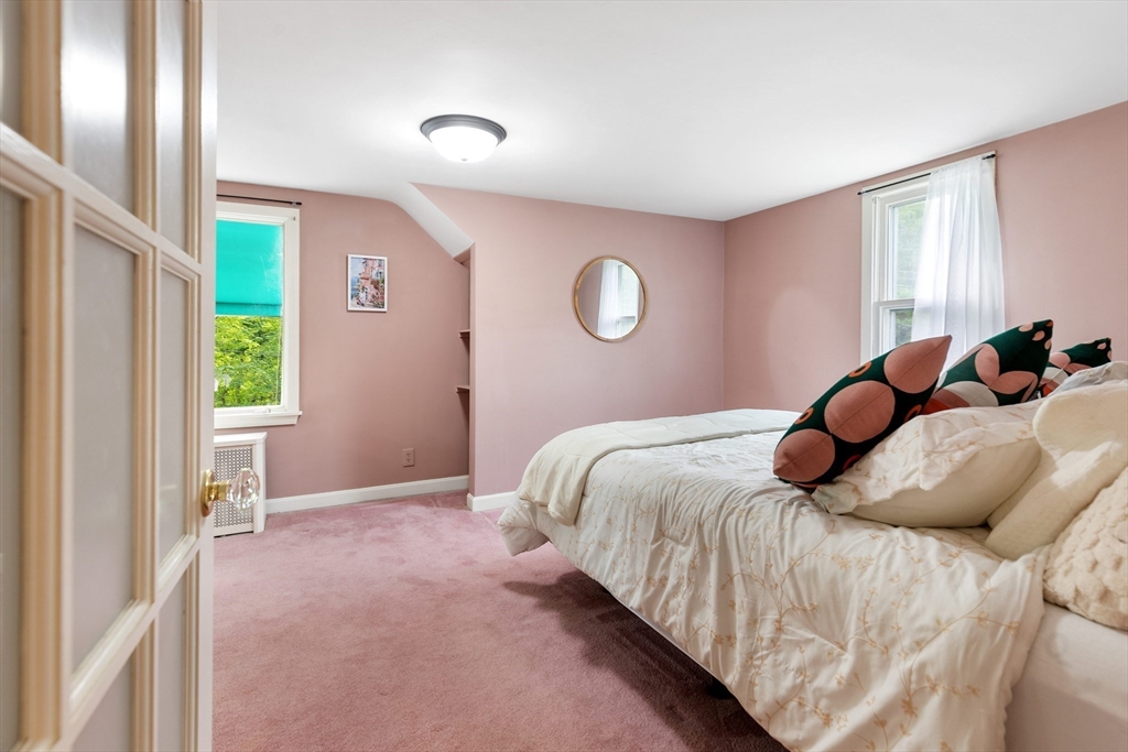 500 Lowell Street Lexington, MA 02420 - Photo 11 of 25 a bedroom with a bed and a window