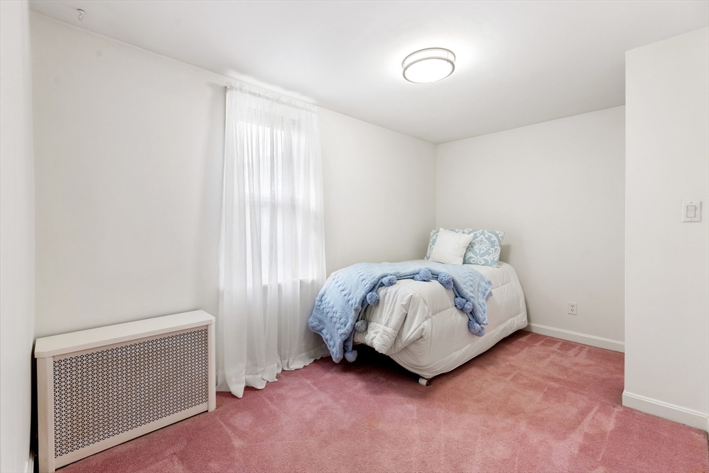 500 Lowell Street Lexington, MA 02420 - Photo 15 of 25 a room with a bed and a window